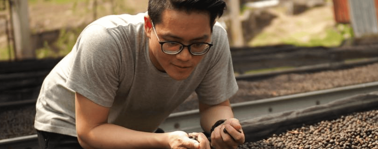 A person in glasses looking down at something
AI-generated content may be incorrect.