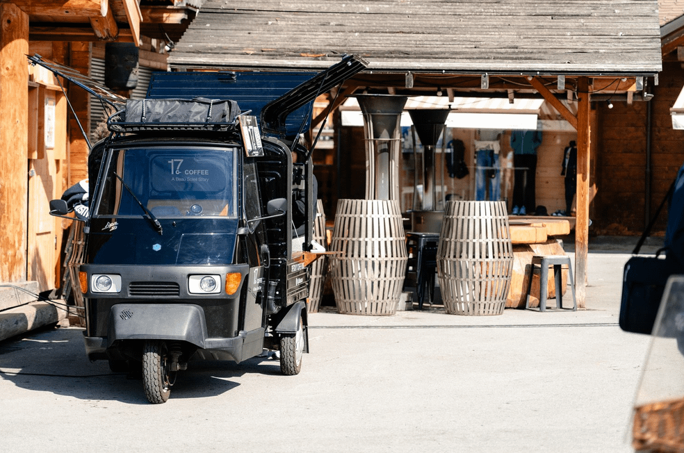 A small black vehicle parked outside a building
AI-generated content may be incorrect.