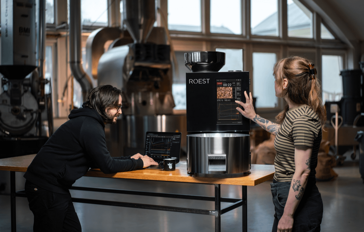 A person and person standing at a counter with a machine
AI-generated content may be incorrect.